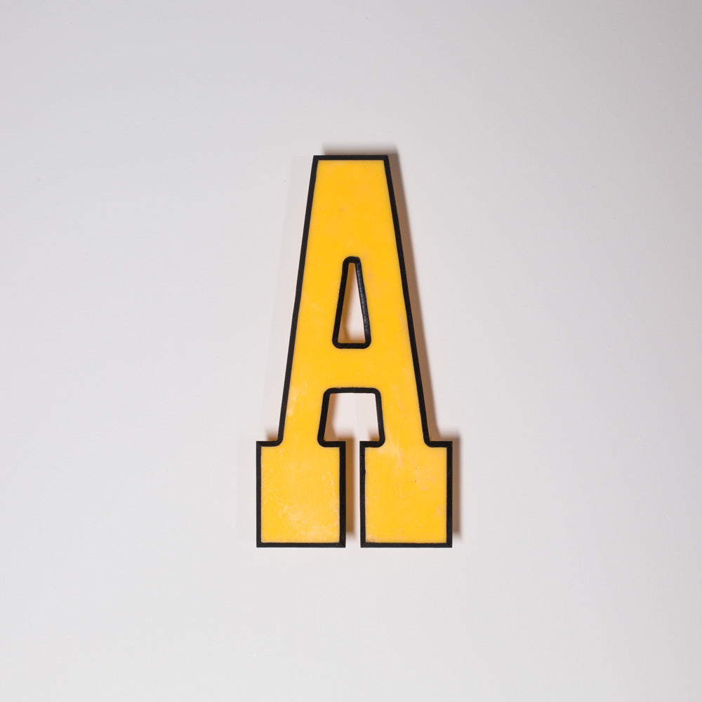 Yellow shop letter signage reclaimed