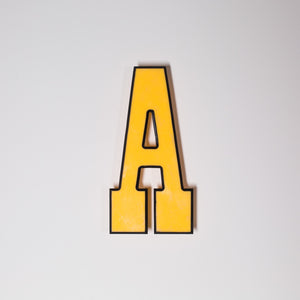 Yellow shop letter signage reclaimed