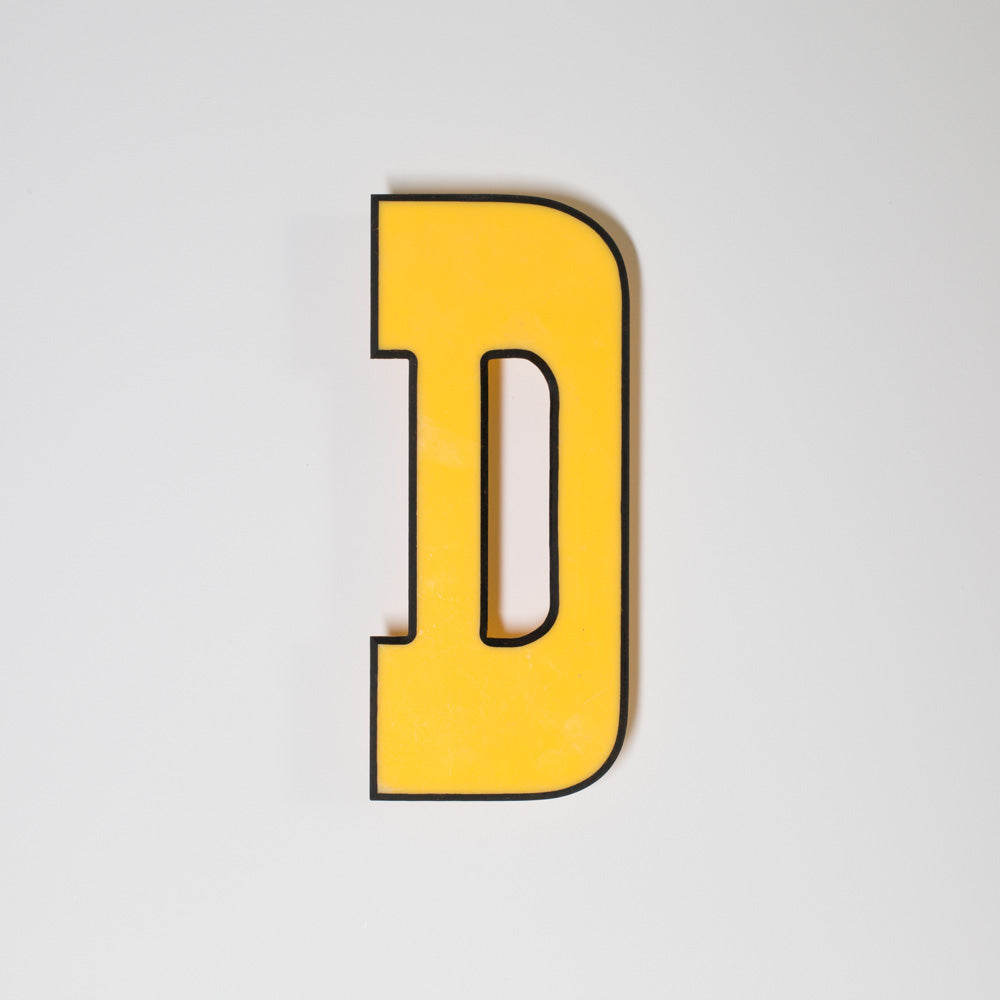Yellow shop letter signage reclaimed