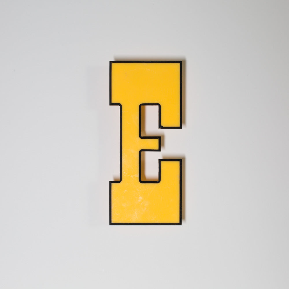 Yellow shop letter signage reclaimed
