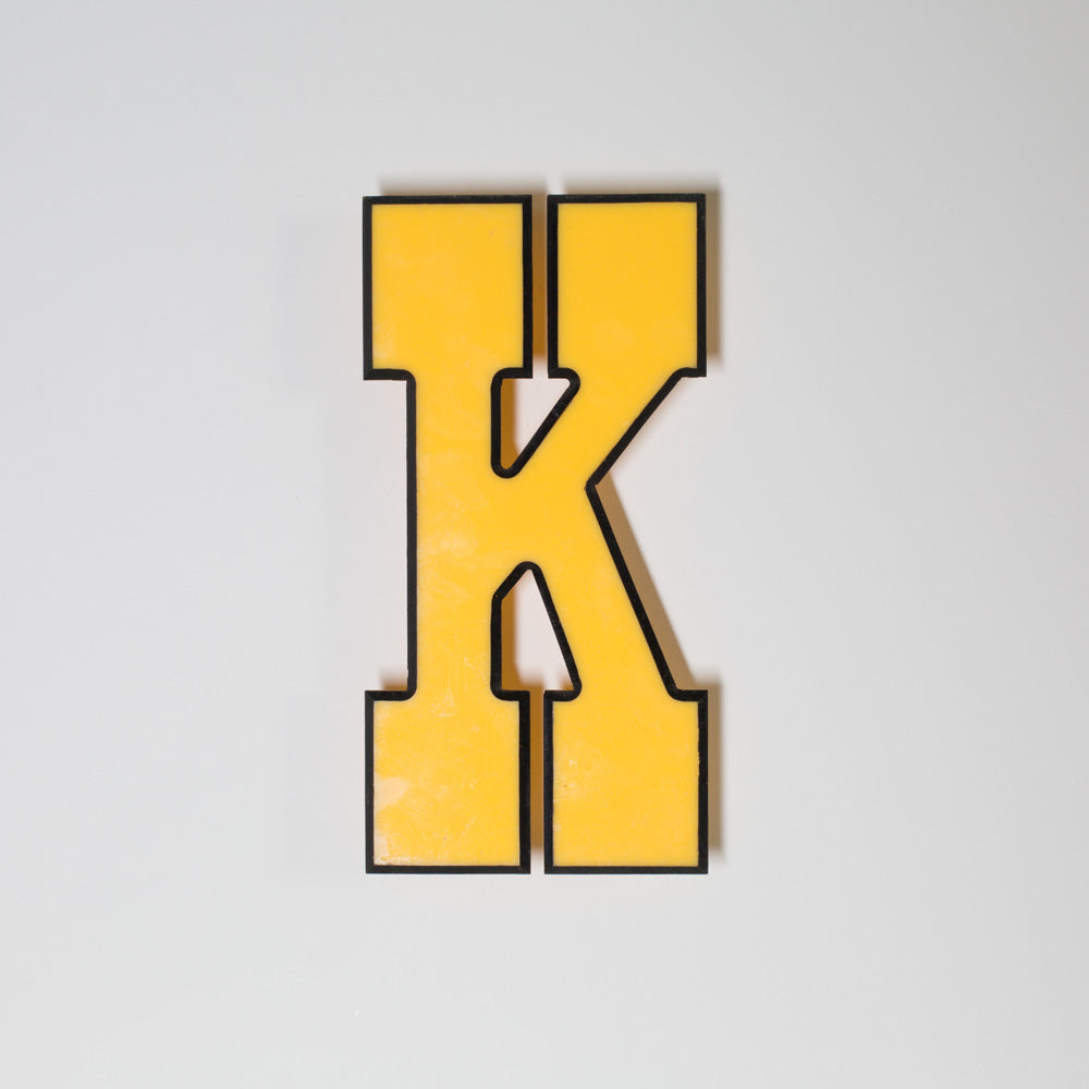 Yellow shop letter signage reclaimed