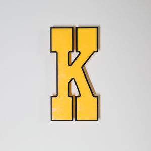 Yellow shop letter signage reclaimed