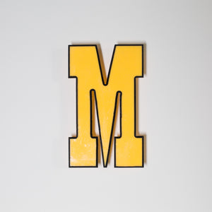 Yellow shop letter signage reclaimed
