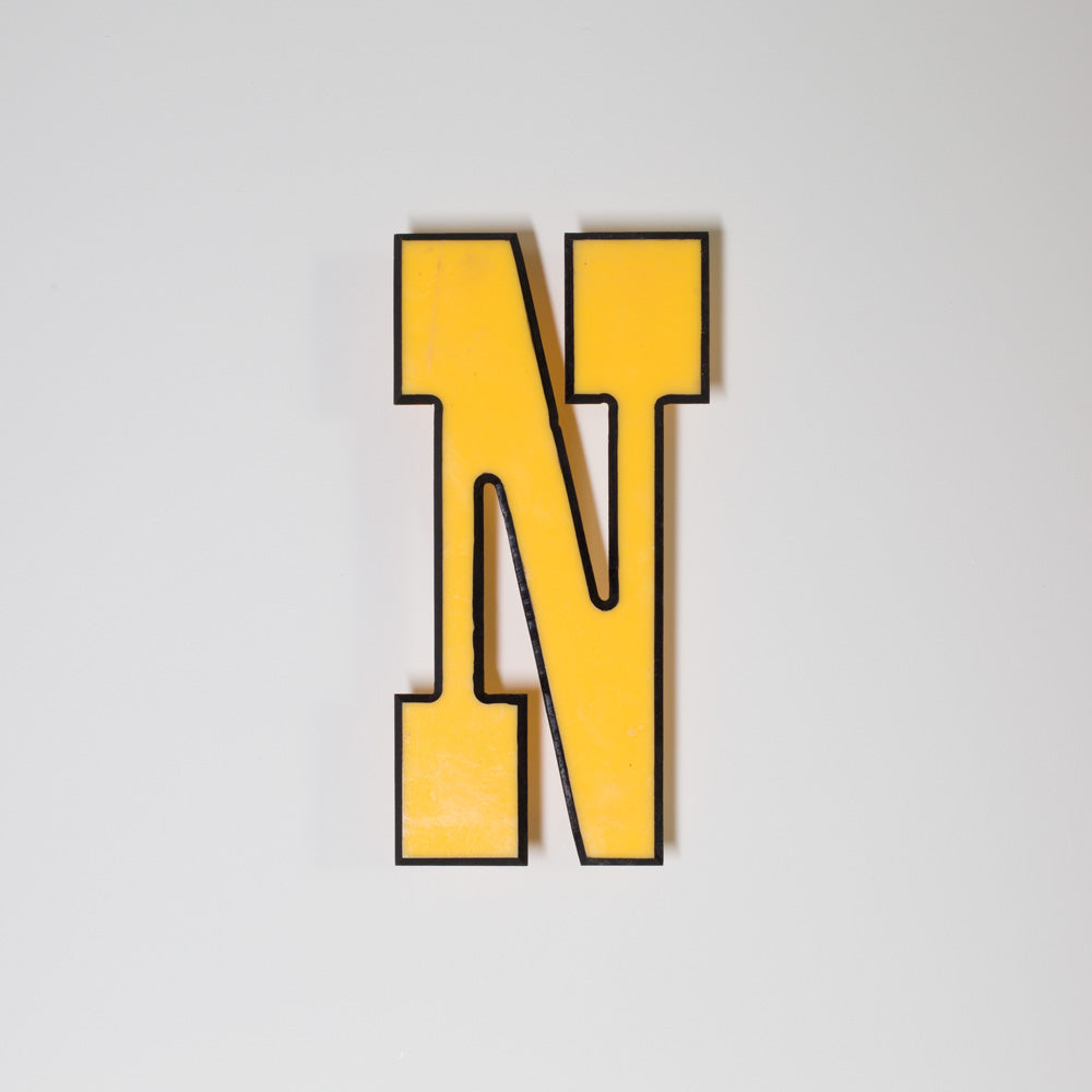 Yellow shop letter signage reclaimed