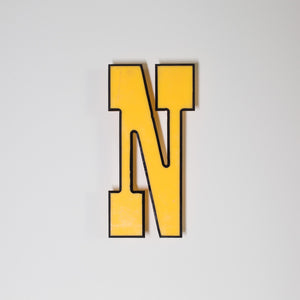 Yellow shop letter signage reclaimed