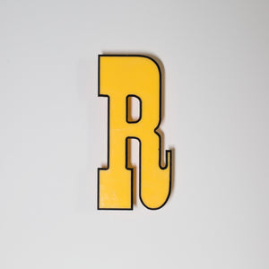 Yellow shop letter signage reclaimed