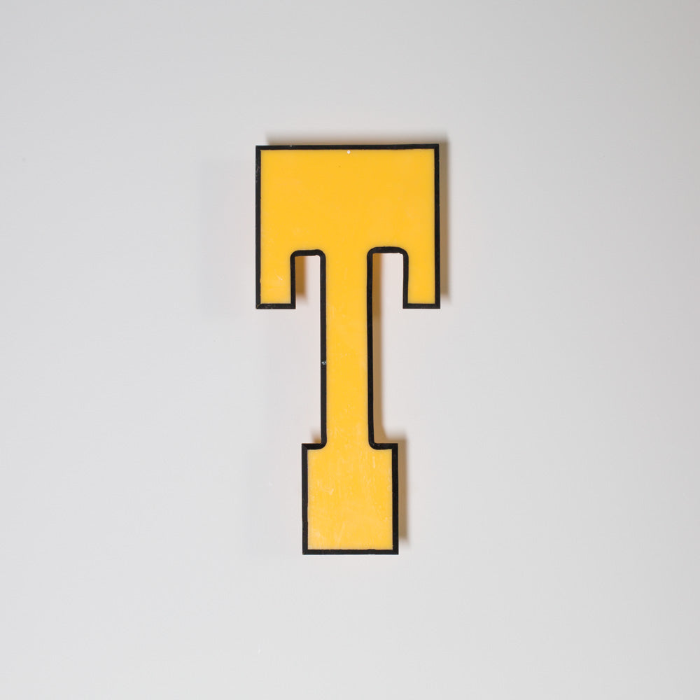 Yellow shop letter signage reclaimed
